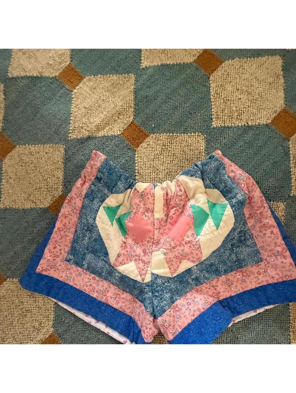 Handmade quilted shorts with pink floral print, blue border green pink geometric